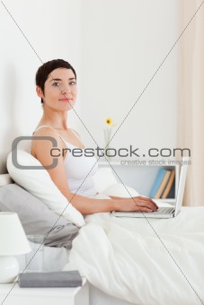 Portrait of a cute woman using a laptop