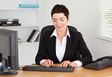 Secretary typing on her keybord