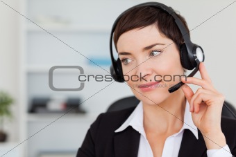 Close up of a secretary calling with a headset