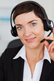 Portrait of a cute secretary calling with a headset