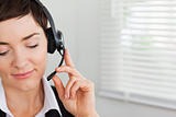 Close up of a focused secretary calling with a headset