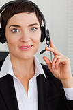 Portrait of a smiling secretary with a headset