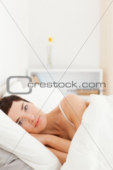 Portrait of a cute woman waking up