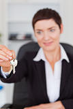 Portrait of a woman showing keys