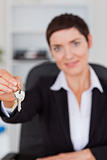 Portrait of a businesswoman showing keys