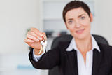 Businesswoman showing keys