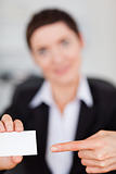 Portrait of a woman showing a blank business card