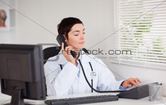 Female doctor calling