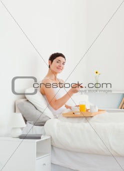 Portrait of a woman eating breakfast