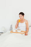 Portrait of a woman drinking juice for breakfast