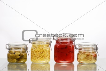Jars with pickles isolated on white