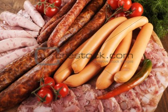 different types of sausages with cherry tomato