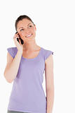 Good looking woman on the phone while standing