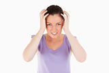 Attractive woman having a migraine while standing