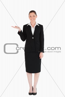 Gorgeous woman in suit showing a copy space