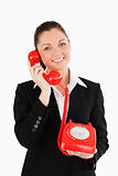 Cute woman in suit on the phone