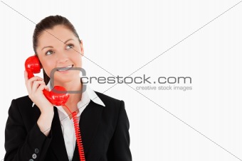 Beautiful female in suit on the phone
