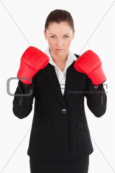 Charming woman wearing some boxing gloves