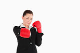 Good looking woman wearing some boxing gloves