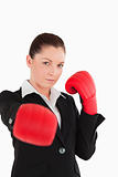 Pretty woman wearing some boxing gloves