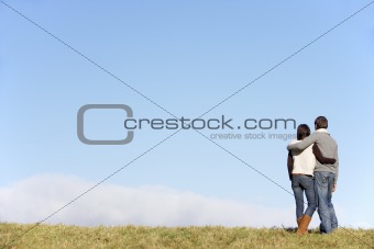 Couple Standing In The Park