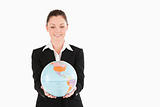 Cute woman in suit holding a globe