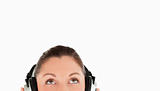 Portrait of a pretty woman posing with headphones while standing