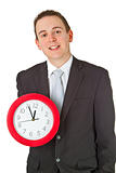 Young businessman holding a clock