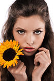 face shot of a pretty girl holding a sunflower