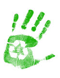 green handprint with recycling symbol in palm over white