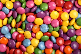 Colorful button-shaped candies filled with chocolate (chocolate beans)