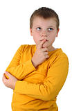 10 year old boy thinking about something with finger on lips isolated on white
