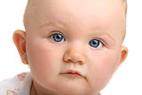 Beautiful baby with blue eyes isolated on white background