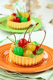 dessert tartlet with colored cocktail cherries