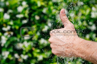 Hands under falling water