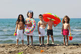 child group have fun and play with beach toys