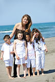 group portrait of childrens with teacher on beach
