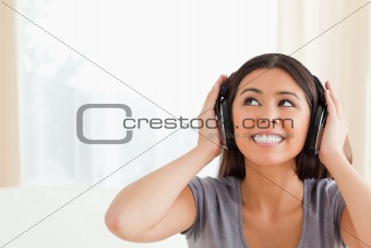 woman with earphones looking up