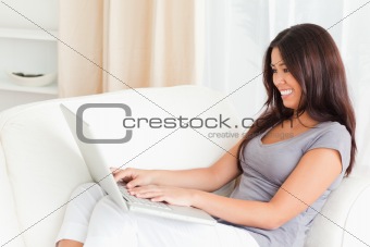 working lady with notebook on sofa