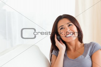 dark-haired woman phoning