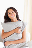 woman with pillow in her arms
