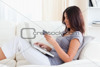 charming woman holding creditcard
