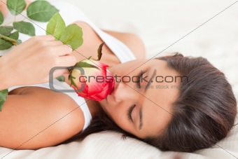 close up of a cute woman with rose