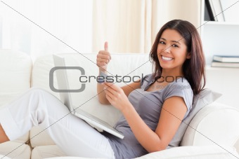 smiling woman with thumb up