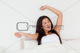 waking beautiful woman in bed eyes closed