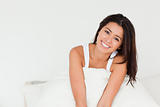 charming woman sitting in bed 