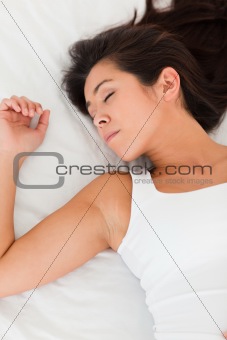sleeping woman lying on bed