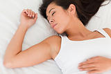 close up of a sleeping woman lying on bed