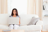 youg woman with notebook on a sofa