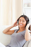 cute woman with earphones and closed eyes
